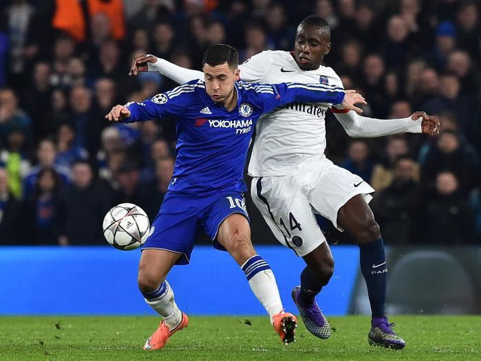 Chelsea midfielder Eden Hazard battles with Paris Saint-Germain midfielder Blaise Matuidi.