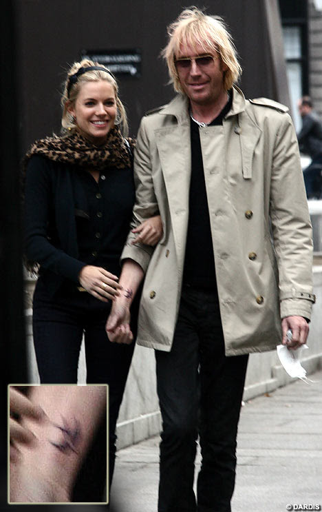  hand-in-hand after he had a bird tattooed onto his wrist, just like her