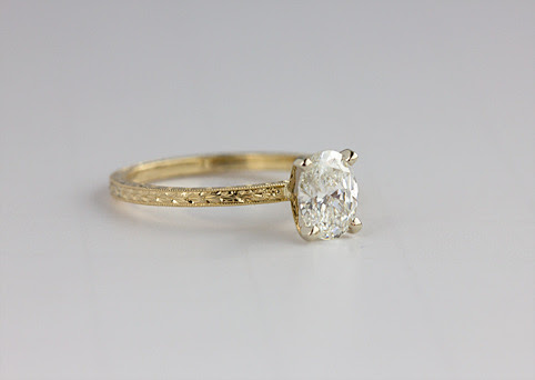 Flat oval engagement rings