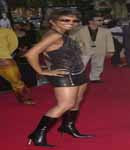Halle Berry dressed in leather and heels.