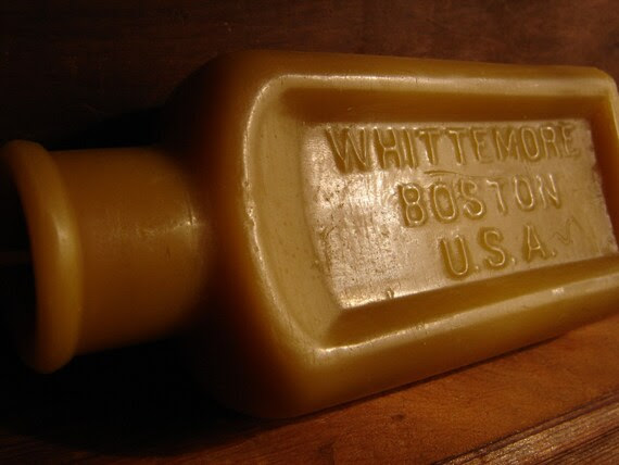 Antique bottle-shaped Beeswax Candle - (Large) "WHITTEMORE BOSTON U.S.A." text early 1900's
