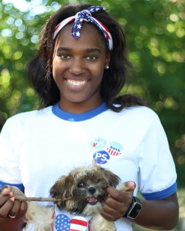 Alexis and her dog outside on a sunny day