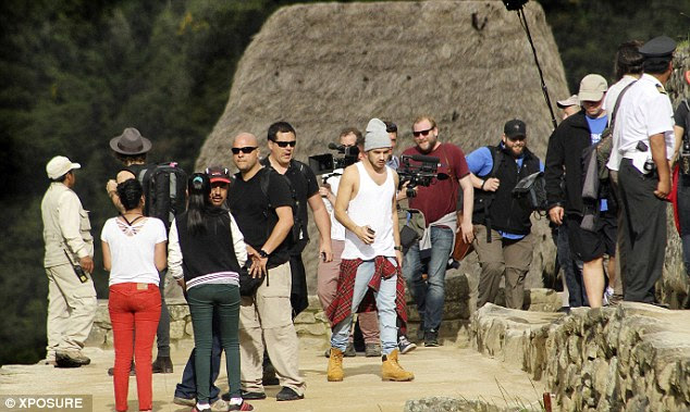 Not on their own: The boys were surrounded by quite a crew during their trip