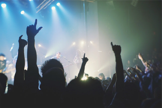 The Smart Way to Use Surveys to Engage and Grow Your Audience engaged audience at a rock concert