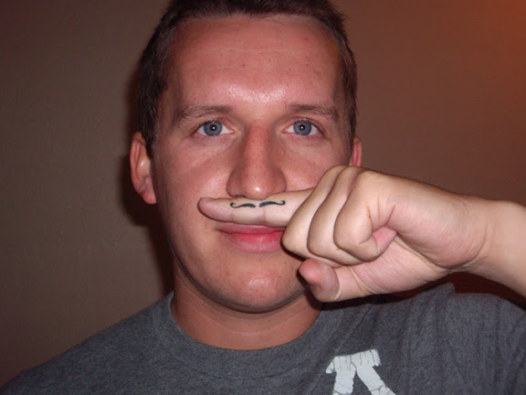  the "mustache tattoo on the finger" 