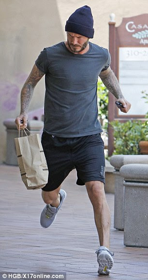 Quick on his feet: Wearing grey workout gear, Beckham looked just as agile as his football days