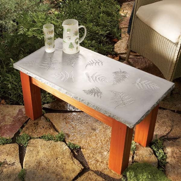 Create a polished concrete table with a solid wood base, with inlays ...