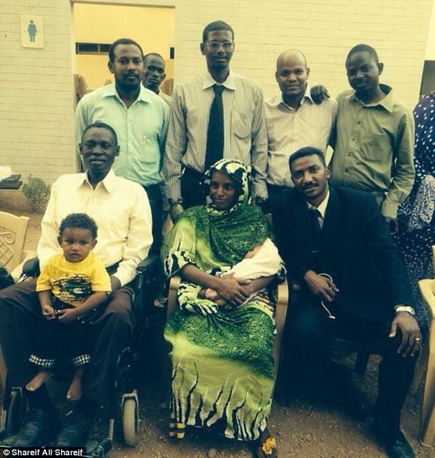 Another blow: Meriam poses hours after her release with her husband, Daniel (left) and her children, Martin (on Daniel's knee) and baby Maya and all those who bravely fought for her freedom in Sudan. Now she has been re-arrested with her husband and children