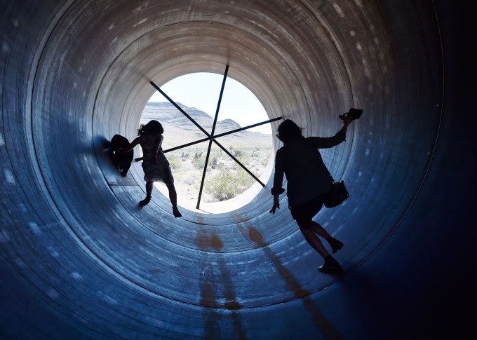NORTH LAS VEGAS, NV - MAY 11: People walk through a Hyperloop tube after the first test of a propulsion system at the Hyperloop One Test and Safety site on May 11, 2016 in North Las Vegas, Nevada. The company plans to create a fully operational hyperloop system by 2020. (Photo by David Becker/Getty Images)