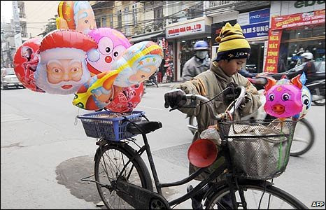 Vietnamese boy sells balloons in Hanoi
