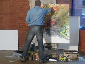 Peter Hill painting for a live audience.