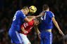 Robin van Persie competes in the air with John Terry and Nemanja Matic 