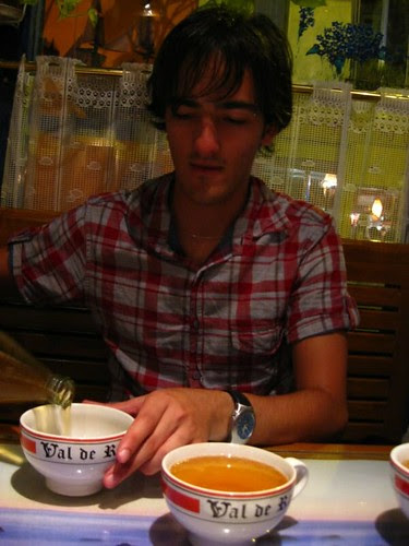 Josh pours cider into a bowl