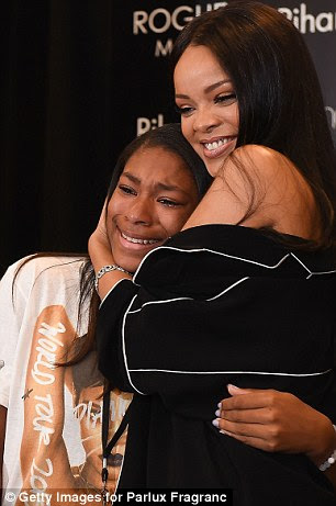 Tears and smiles: Some fans seemed more excited than others to meet Rihanna in person