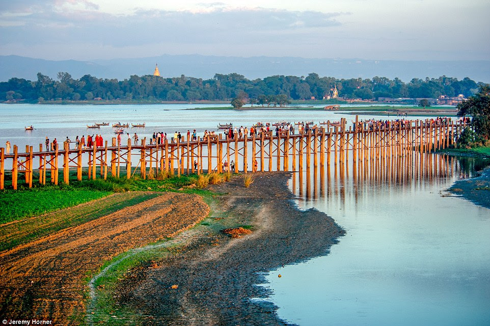 The striking U Bein Bridge is a crossing that spans the Taungthaman Lake near Amarapura in Myanmar. The 0.74 mile-long bridge dates back to 1850 and is believed to be the oldest and longest teakwood bridge in the world
