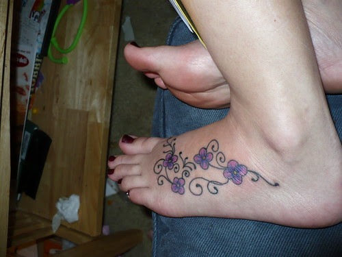 Daisy Tattoos and Daisy Tattoo designs. A daisy is very much loved for its