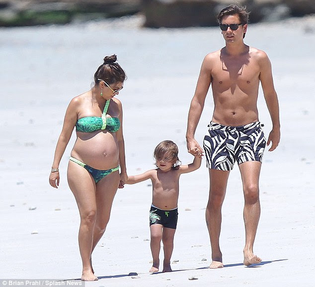 Hand-in-hand: The doting parents cherished spending quality time with their gorgeous son 