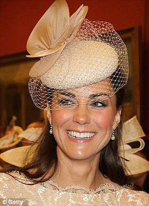 Firm favourite: The cocktail hat in beaded chiffon and trimmed with silk chiffon and tulle discs is one of her firm favourites 
