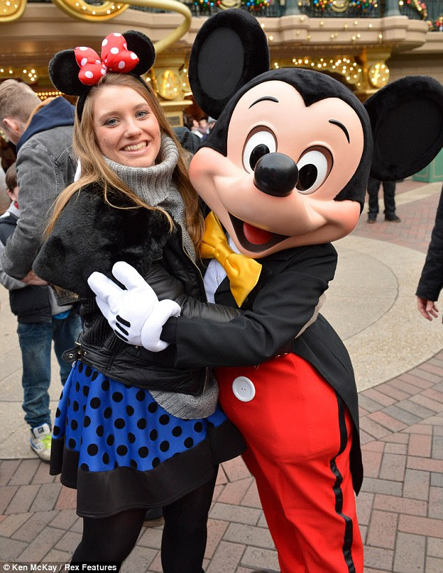 She's a mini Minnie! Mickey makes a grab for Ella