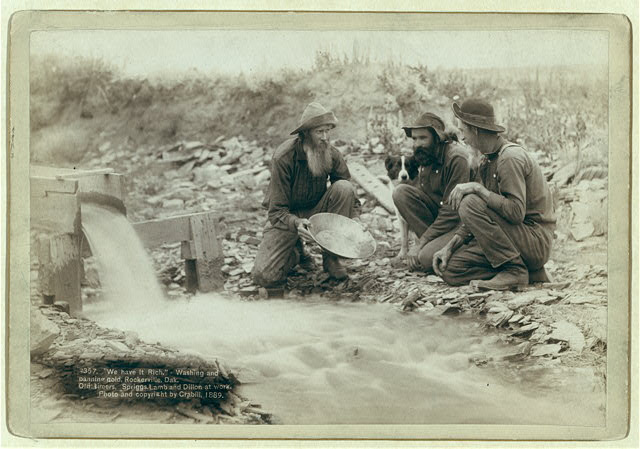 "We have it rich." Washing and panning gold, Rockerville, Dak. Old timers, Spriggs, Lamb and Dillon at work