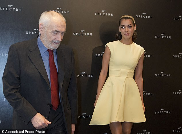 Producer Michael G. Wilson and Bond girl Stephanie Sigman arrive for a photo call ahead of a press conference to discuss Sigman's role in the  upcoming 007 film Spectre in Mexico City