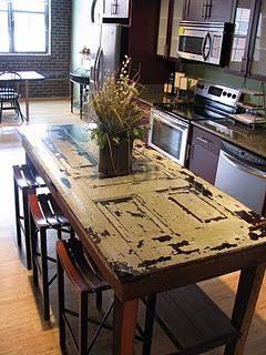 Old Salvaged Door...re-purposed into a prim kitchen island/table.