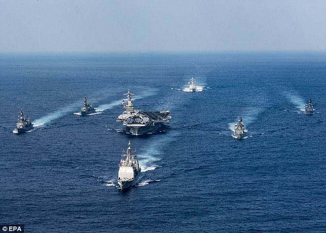 The U.S. Navy aircraft carrier USS Carl Vinson, the guided-missile destroyer USS Wayne E. Meyer and the guided-missile cruiser USS Lake Champlain are pictured in March this year