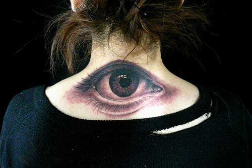 The black and white tattoo of a human eye is very well detailed and a unique 