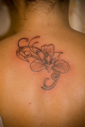 Tattoo Picture Blossom on Upper Back Girl