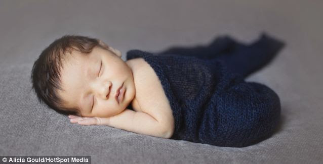 Snug: Alicia explains that half the challenge is getting the children's parents to relax during an undoubtedly nervy first few weeks of parenthood