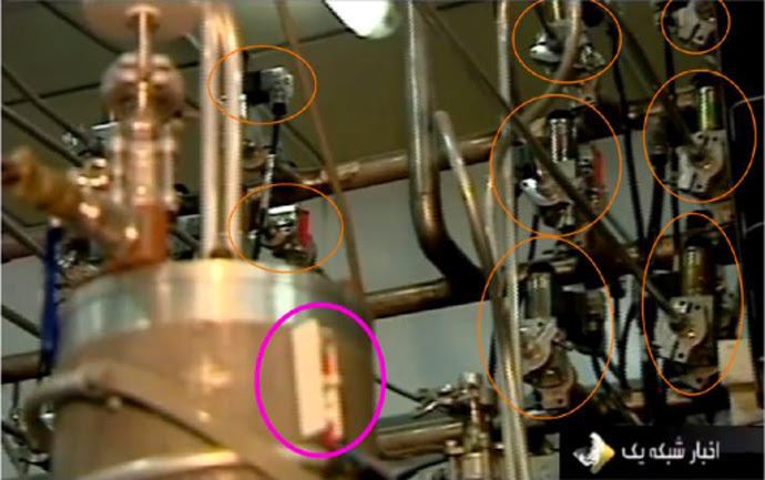 Connector pipes are equipped with isolation valves. The purpose of the valves is to isolate centrifuges from a cascade that start to vibrate, as signaled by vibration sensors (highlighted in magenta). Picture from ‘To Kill a Centrifuge’, a report on Stuxnet malware by Ralph Langner. 