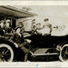Eleven people and a car.