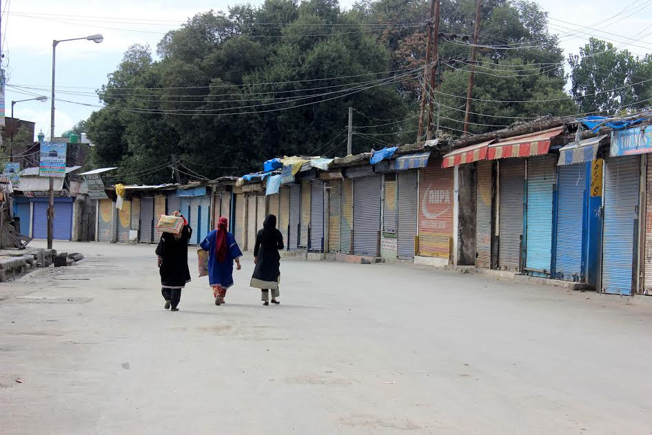 Aloof, a group of three ladies walk deserted road in Islamabad district on August 31, 2016. (KL Image: Shah Hilal)