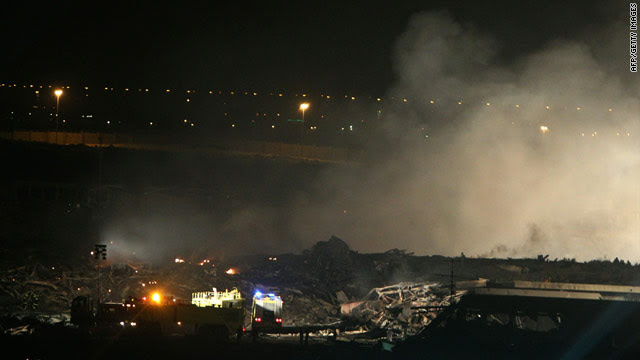 An image dated September 3, 2010 shows smoke rising from the crash scene of a UPS cargo plane at a military base in Dubai.