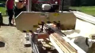 Norwood-portable-sawmill-owner-elvind-his-family-mill-edge-lumber-on 