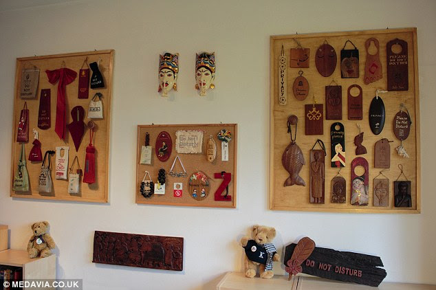 Pride and joy: The display of some of the 8,244 collection in Flores' home