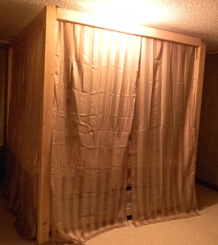 Hubby homemade canopy bed with the curtains all on...