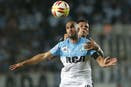 Lisandro López, al frente: el capitán de Racing, titular esta noche.
