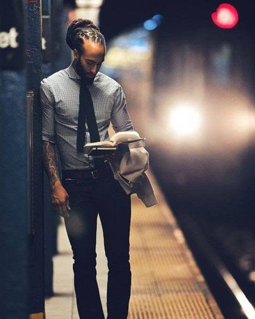 Black Men Are Beautiful. I don't know who this brother is but his attire, his skinny tie, he's reading, and his beautiful dreads. God is good.