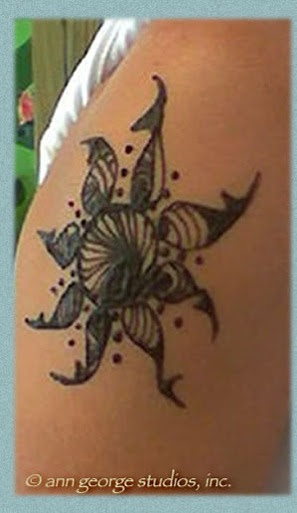 This is so perfect tattoo design for your foot. tribal sun henna tattoo