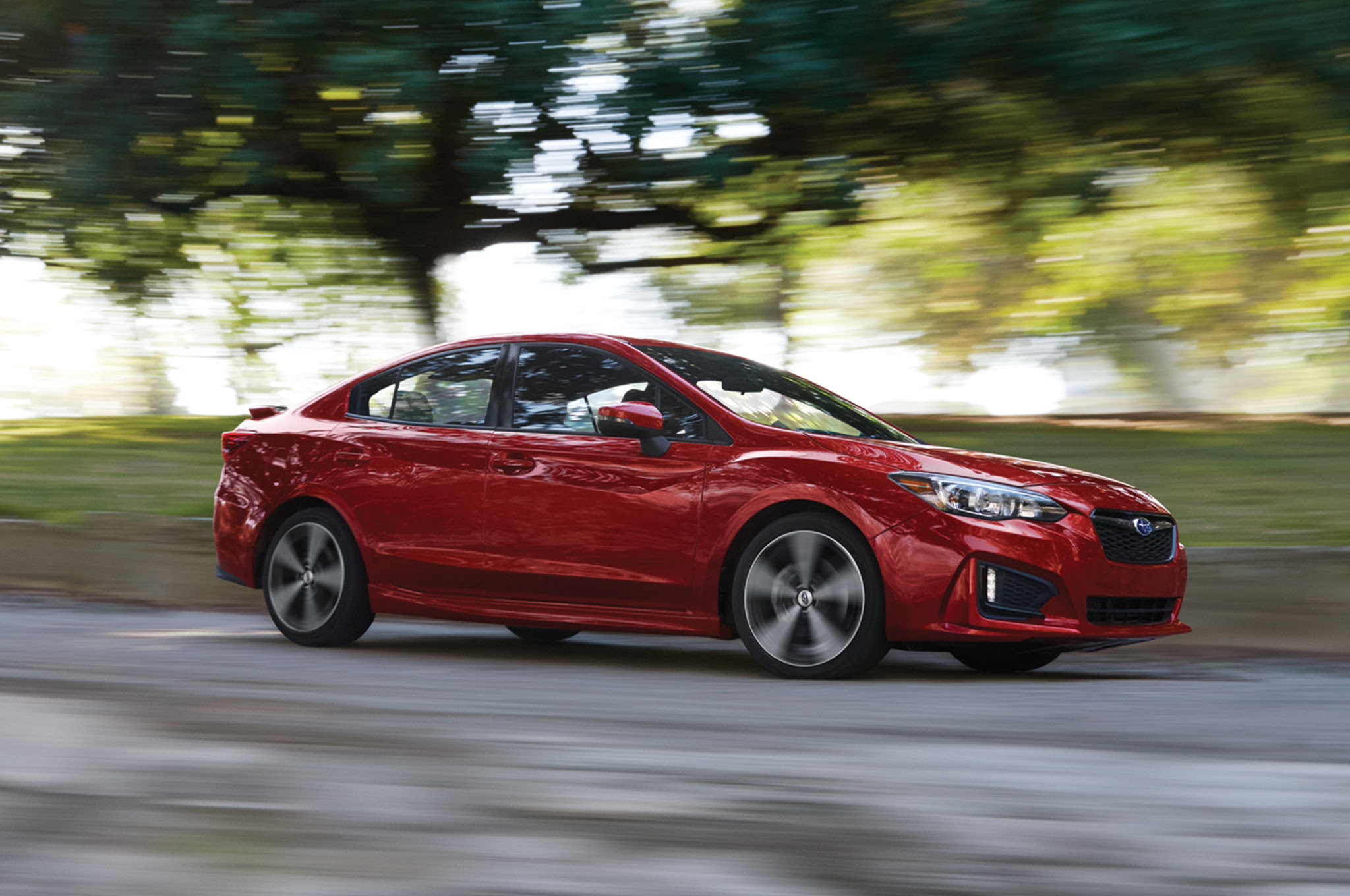 2017 Subaru Impreza 20i Sport side in motion