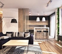 The living, kitchen, and dining space all have easy communication with one another. In order to make this possible, the design has to both separate and connect the disparate spaces. Patterns and unique design elements manage to do this well. In the kitchen, a half wall made out of wood slats creates more division but still allows light and air to flow through. Similarly, a swirled rug design in the living room contrasts a checked pattern in the entryway, which makes it easier to divide spaces.