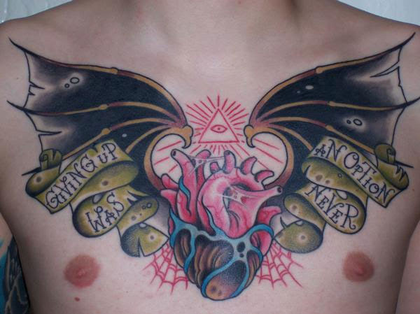 Here's a great chest tattoo of bat wings on a heart.