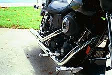 Twin-cam, dual exhaust and billet foot pegs all found on our customized model. 