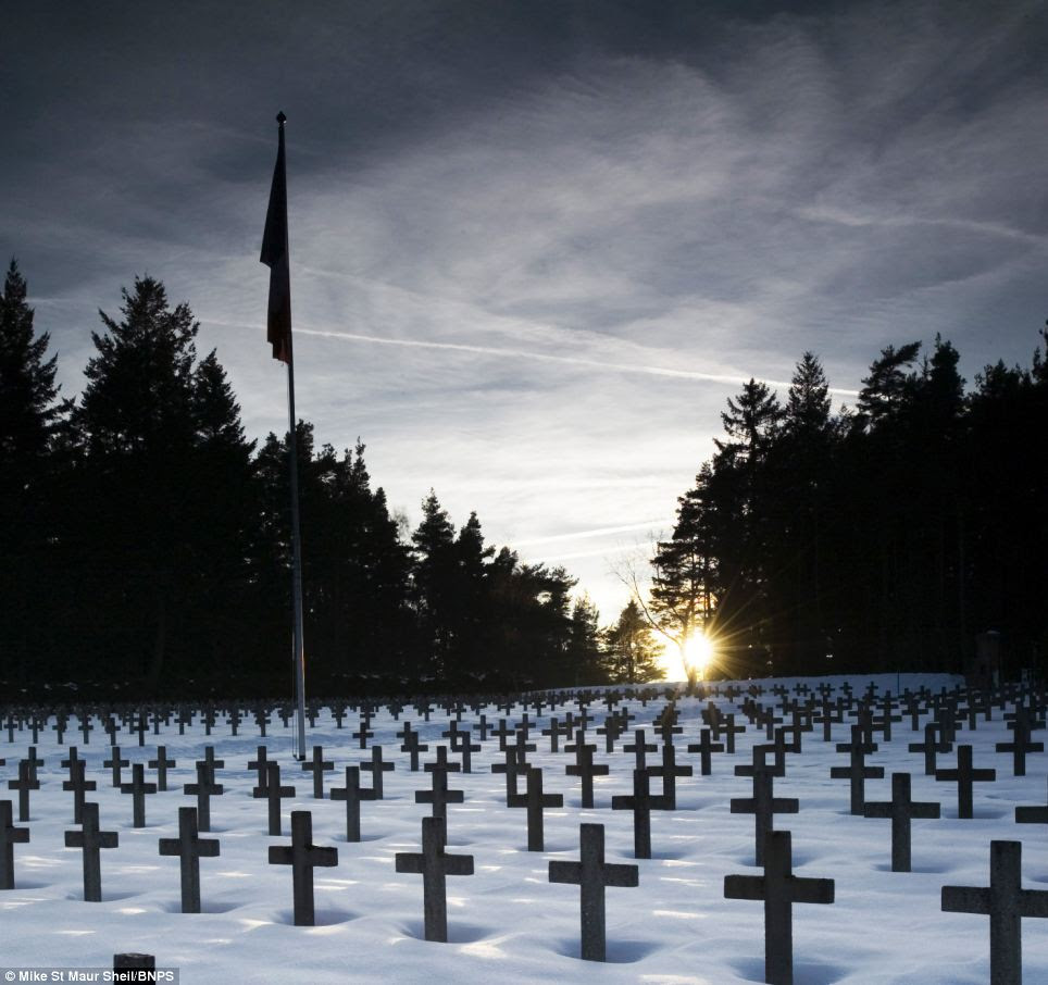 Crossfire: German cemetery at Le Linge near the Weiss valley which was attacked by the French in 1915. Today the German tranches are remarkably well preserved.