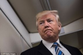 Trump is seen here aboard Air Force One in Maryland on Saturday
