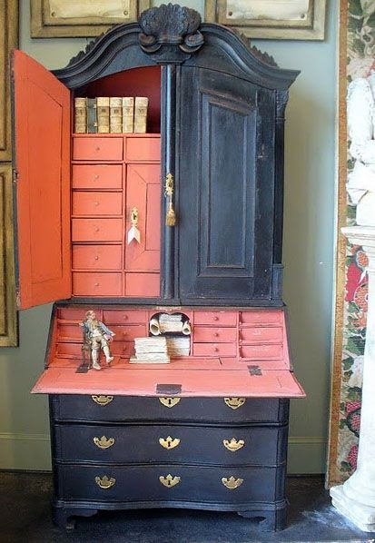 I love the salmon-ey pink inside...thinking I should paint the inside of my built in hutch this color.