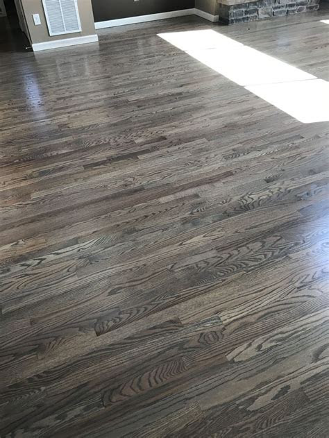 When decorating or refinishing their homes, many homeowners prefer a more natural look, such as one they might get with red oak wood. Red oak floors stained with classic gray #