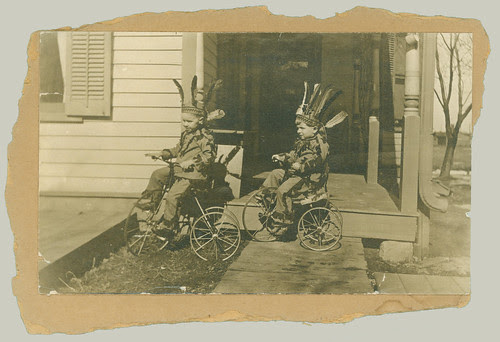 Two children on tricycles