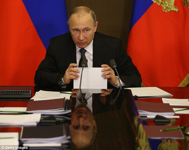 Russian President Vladimir Putin attends a meeting with top military officials May 19, 2017 in Sochi, Russia. Vladimir Putin is spending a busy week in Sochi looking into Army Forces development and the defence-industrial sector, his spokesman Dmitry Peskov said